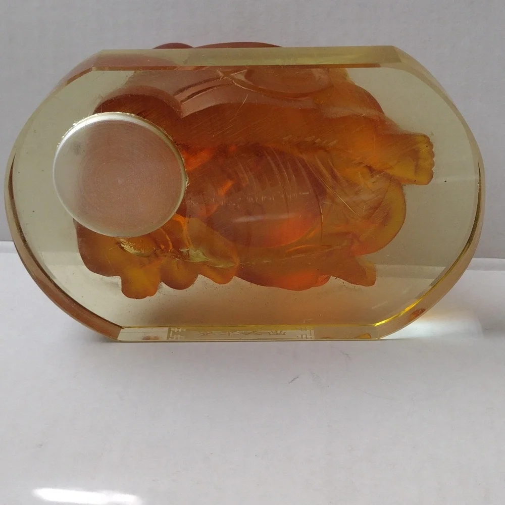 Orange Buddha Figurine